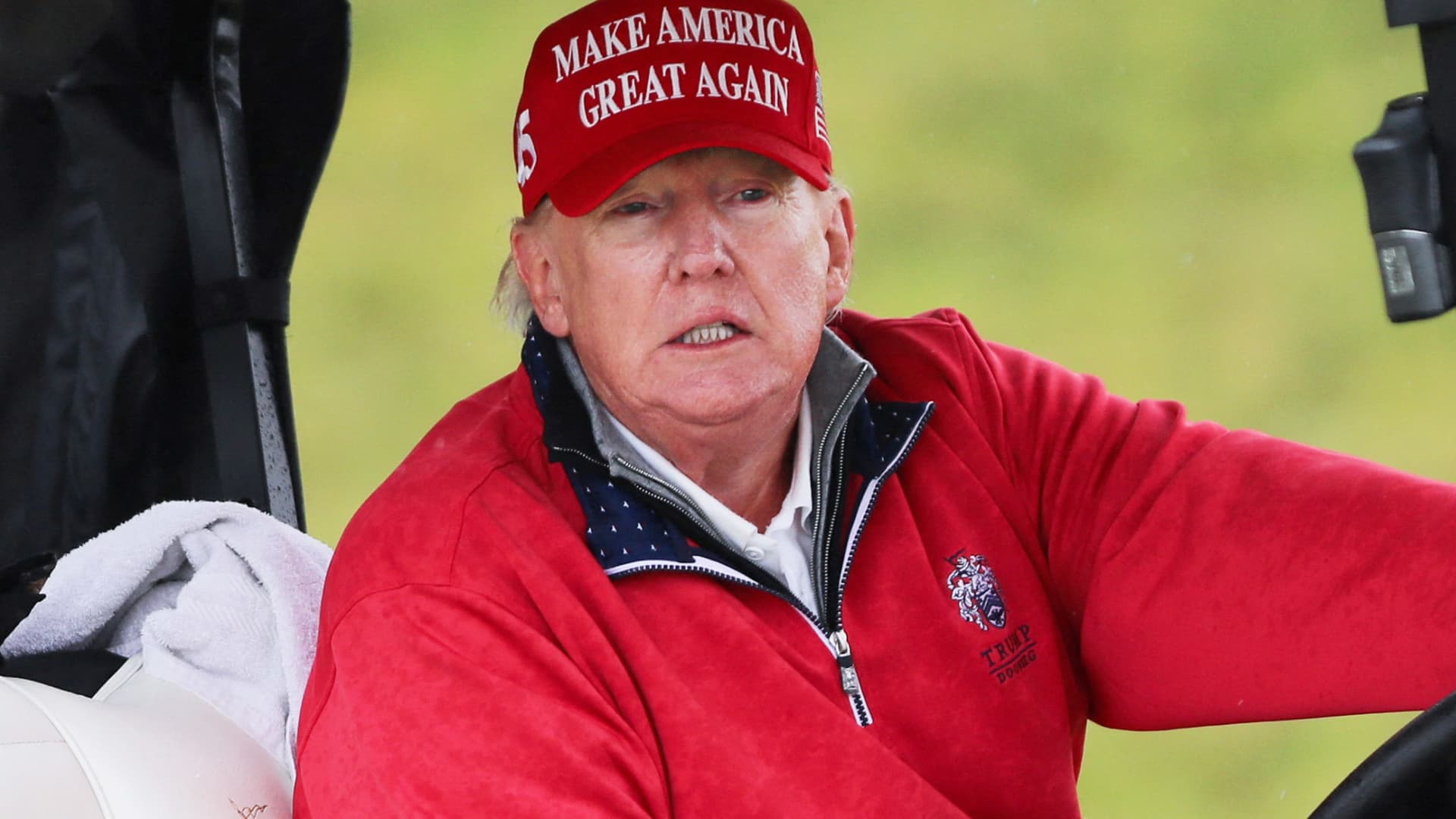 Former U.S. President and Republican presidential candidate Donald Trump rides a golf cart at Trump International Golf Links course, in Doonbeg, Ireland May 4, 2023.