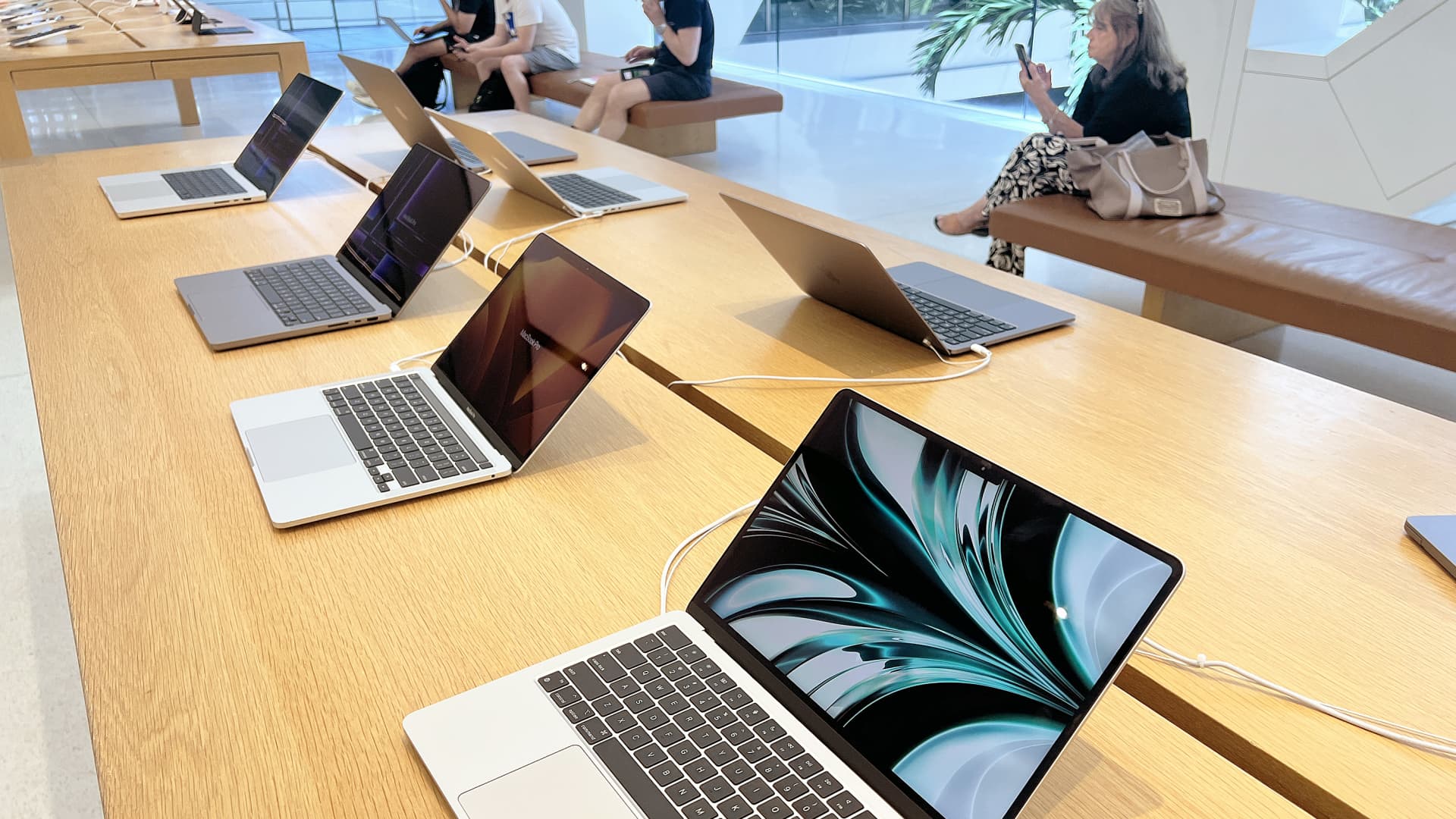 Apple laptop computers on display in an Apple store on May 04, 2023 in Miami, Florida.