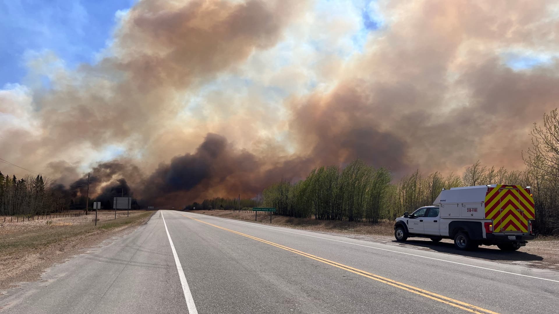 A smoke column rises from wildfire EWF-035 near Shining Bank, Alberta, Canada May 5, 2023. 