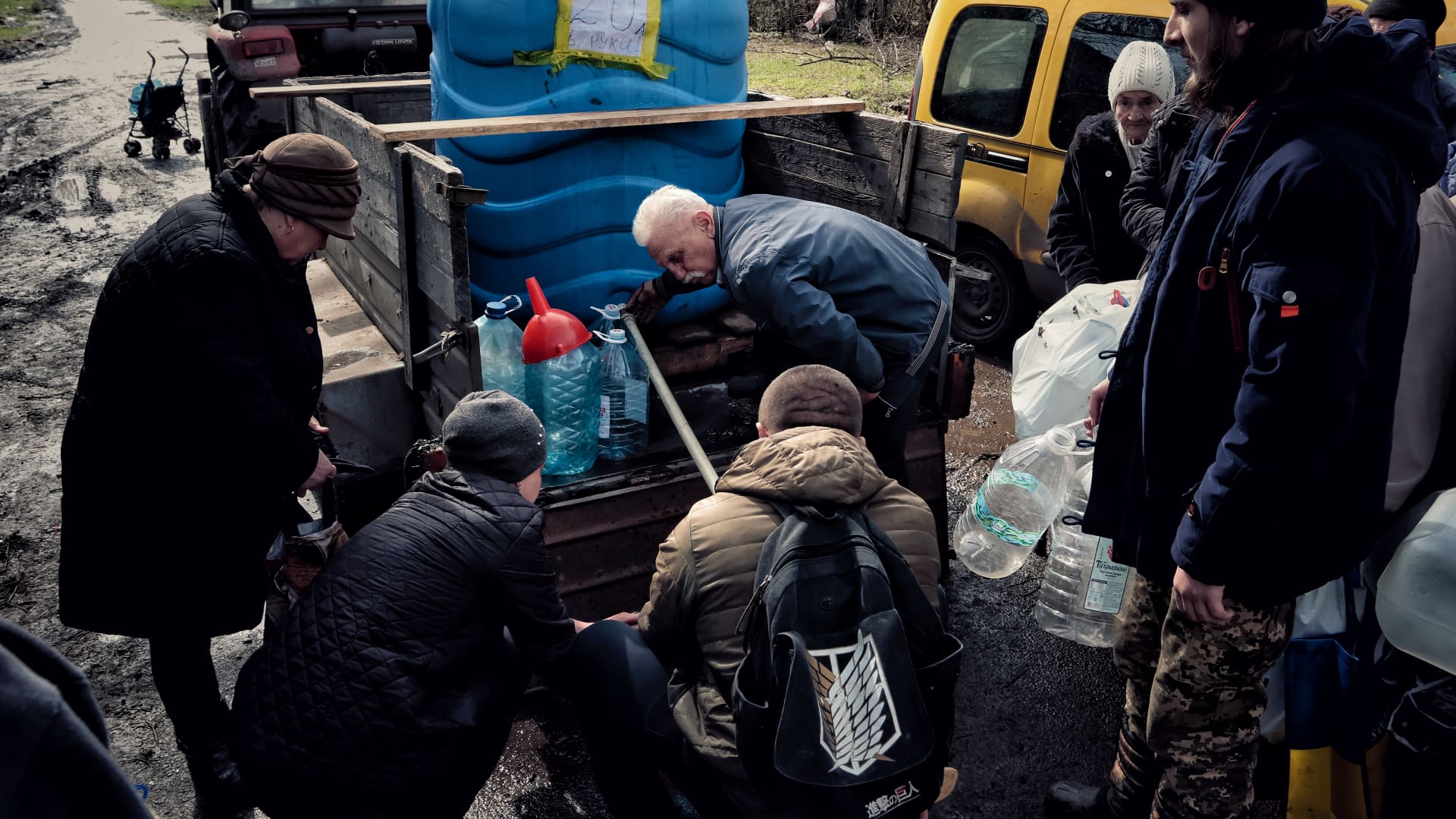 Local residents stand in line for drinking water brought by volunteers on April 7, 2023 in Donetsk Oblast, Ukraine. Despite the constant shelling, there are still civilians in the frontline cities, who sometimes have to bring humanitarian aid with the help of military equipment. (Photo by Yan Dobronosov/Global Images Ukraine via Getty Images)