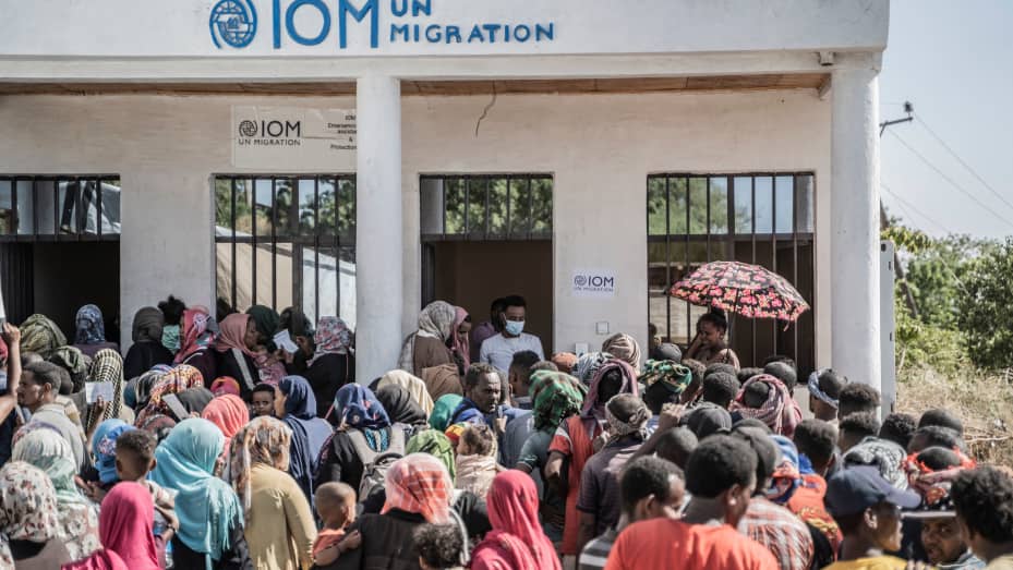 METEMA, Ethiopia - May 4, 2023: Refugees who crossed from Sudan to Ethiopia wait in line to register at IOM (International organization for Migration) in Metema, on May 4, 2023. More than 15,000 people have fled Sudan via Metema since fighting broke out in Khartoum in mid-April, according to the UN's International Organization for Migration, with around a thousand arrivals registered per day on average