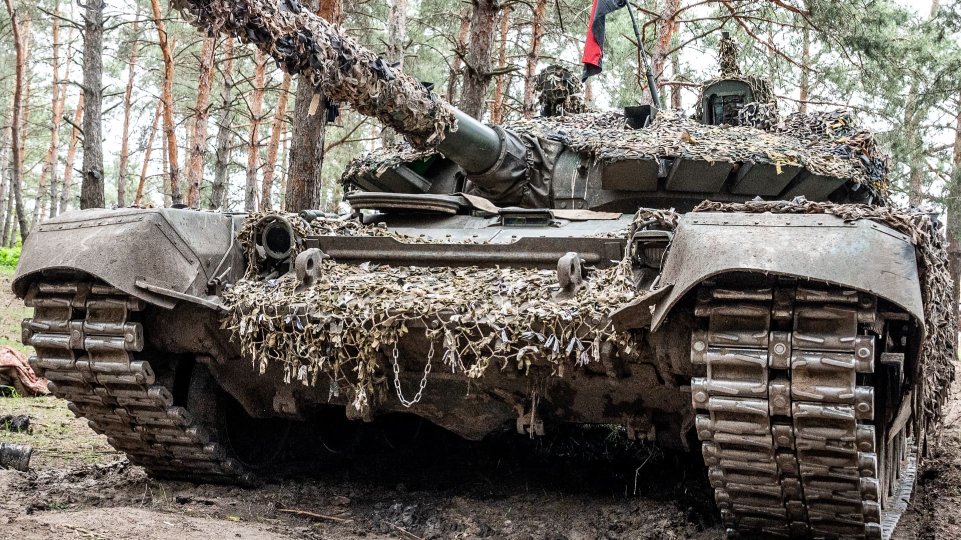 View of a captured Russian T-72 tank hidden in a forest near Kivsharivka, Ukraine.