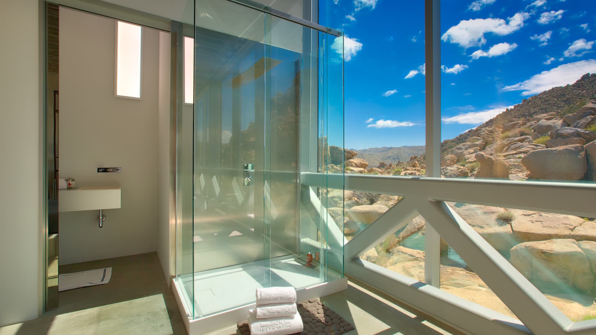 The glass-encased shower in one of the home's guest bedrooms.