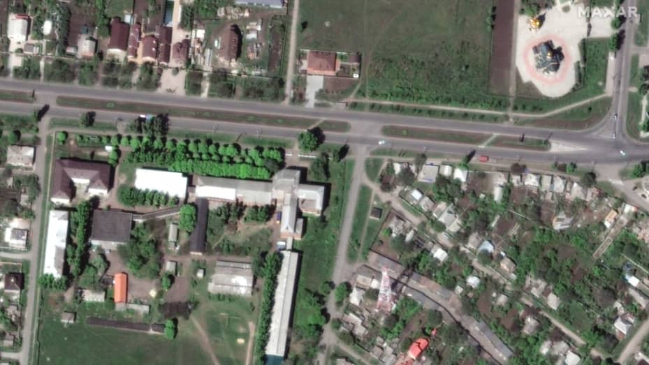 BAKHMUT, UKRAINE -- MAY 8, 2022:  11 - Maxar satellite imagery comparing the before/after destruction of University buildings amd a aradio tower in Bakhmut, Ukraine.  Please use: Satellite image (c) 2023 Maxar Technologies.