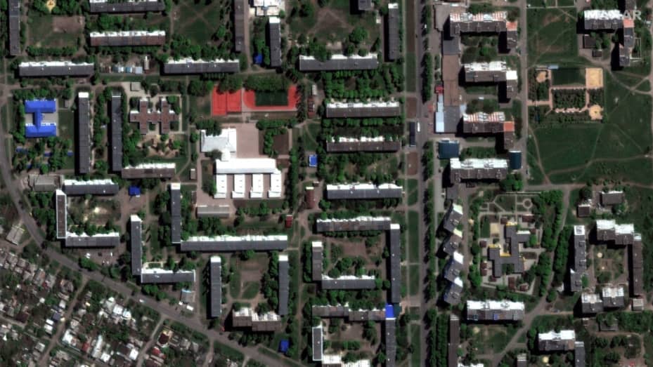BAKHMUT, UKRAINE -- MAY 8, 2022:  09 - Maxar satellite imagery comparing the before/after destruction of the Bakhmut high school and homes in Bakhmut, Ukraine.  Please use: Satellite image (c) 2023 Maxar Technologies.