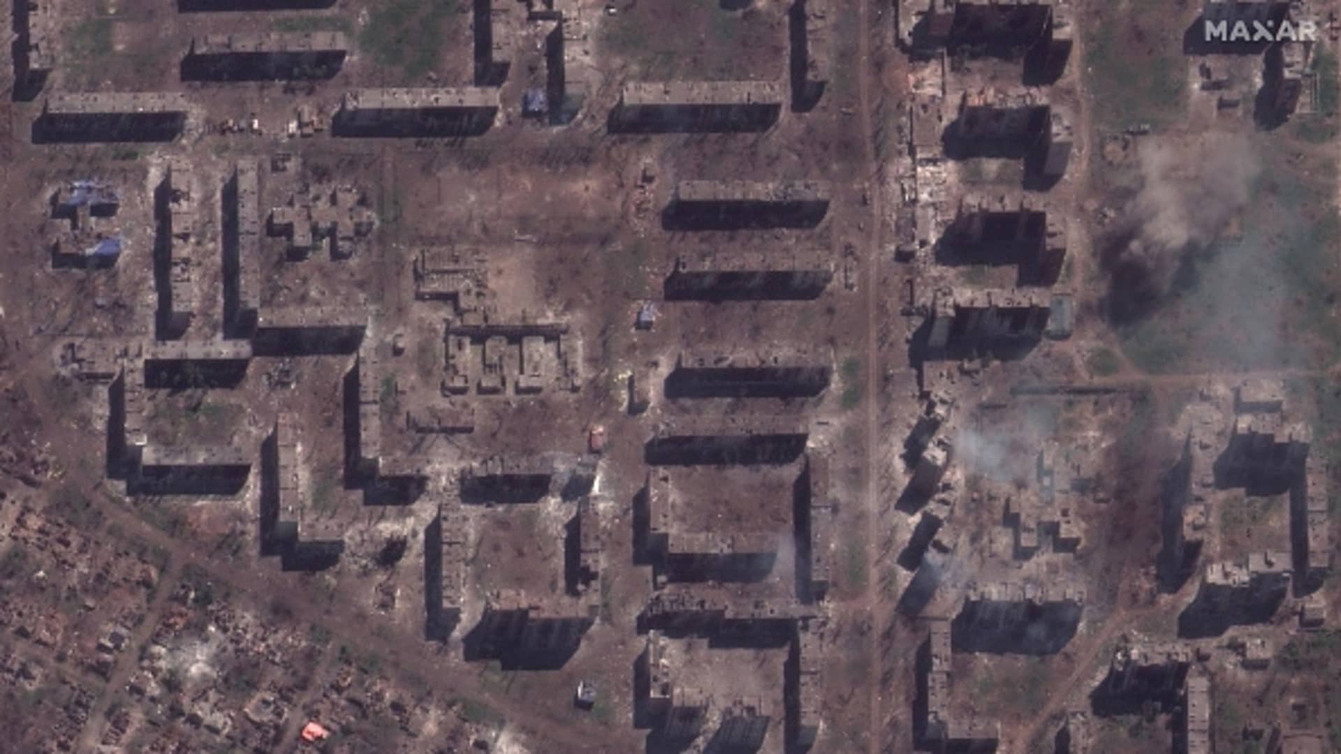 Maxar satellite imagery comparing the before/after destruction of the Bakhmut high school and homes in Bakhmut, Ukraine. 