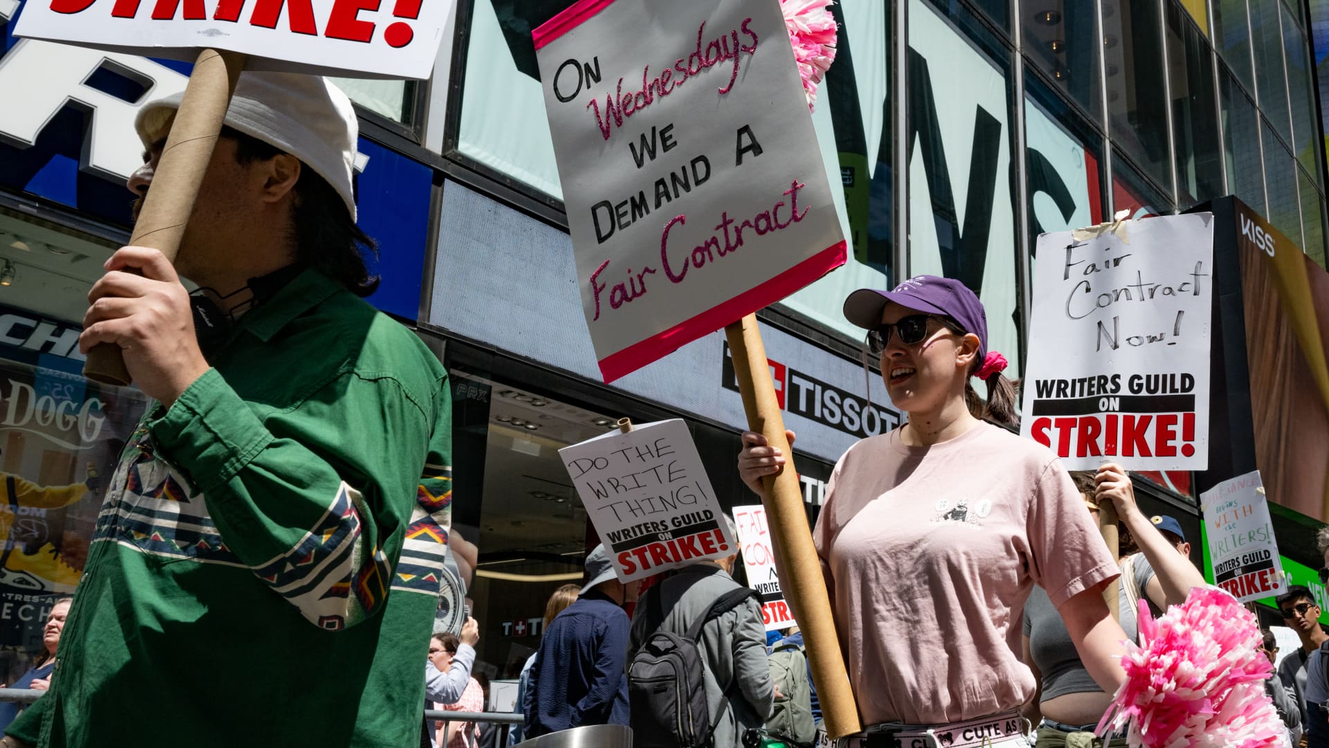  Writers Guild of America (WGA) East members walk a picket line at the Paramount+ Summit outside the Paramount Building in Times Square on May 17, 2023 in New York City. 