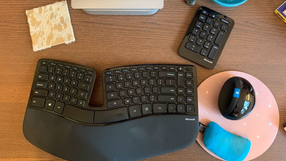 Brittany Matter's home desk in Olympia, Wash., features the mouse, keyboard and number pad that come in the Microsoft Sculpt Ergonomic Desktop set, which has been discontinued. She sticks the keyboard in a backpack when she travels, because she likes to be comfortable when she works.