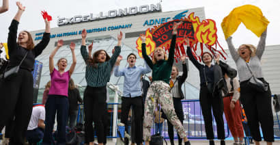 Climate protesters try to storm stage at Shell’s annual shareholders meeting