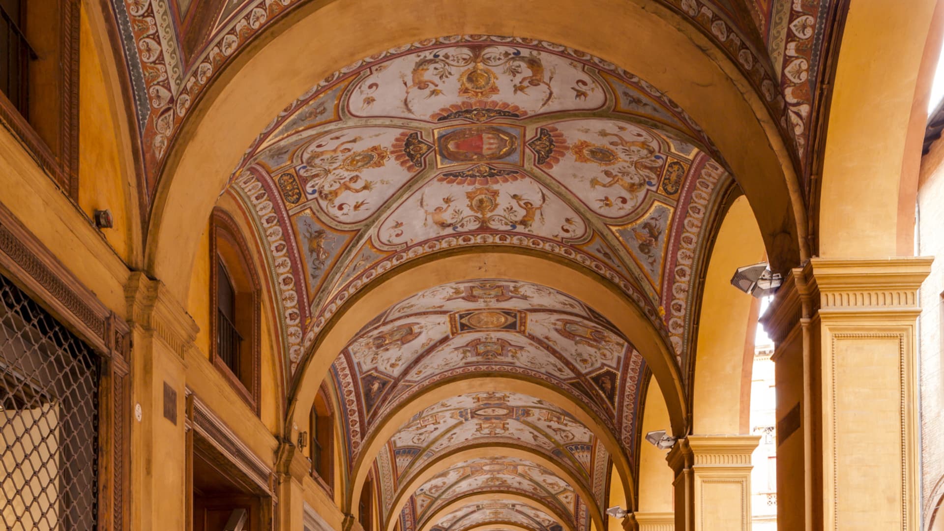 The porticoes of Bologna are often covered in decorative tiles or paintings.