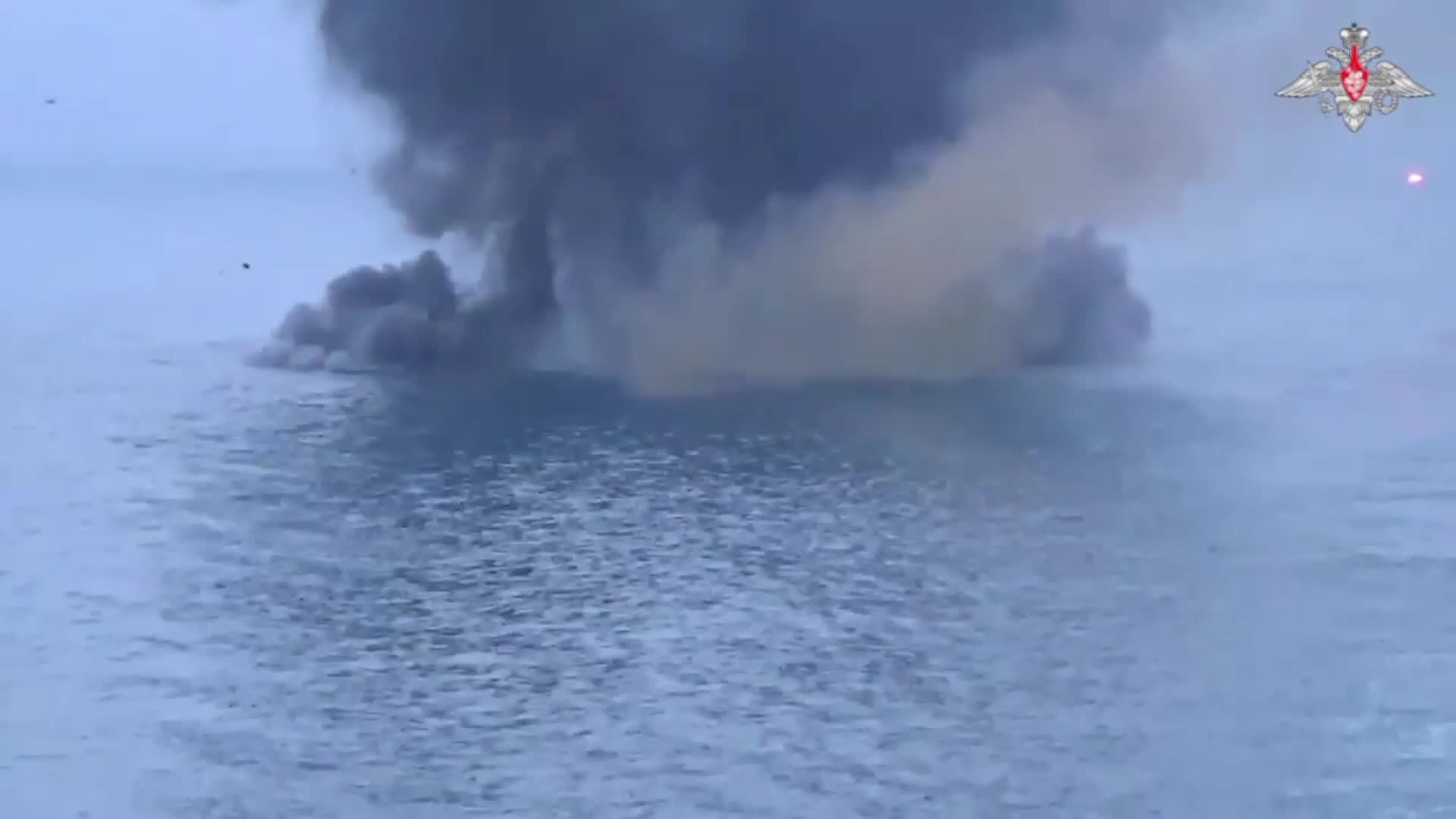 A screen grab captured from a video shows Russian warship belonging to its Black Sea fleet allegedly destroying unmanned surface vessels (AUSV) of Ukraine in Black Sea on May 24, 2023. 