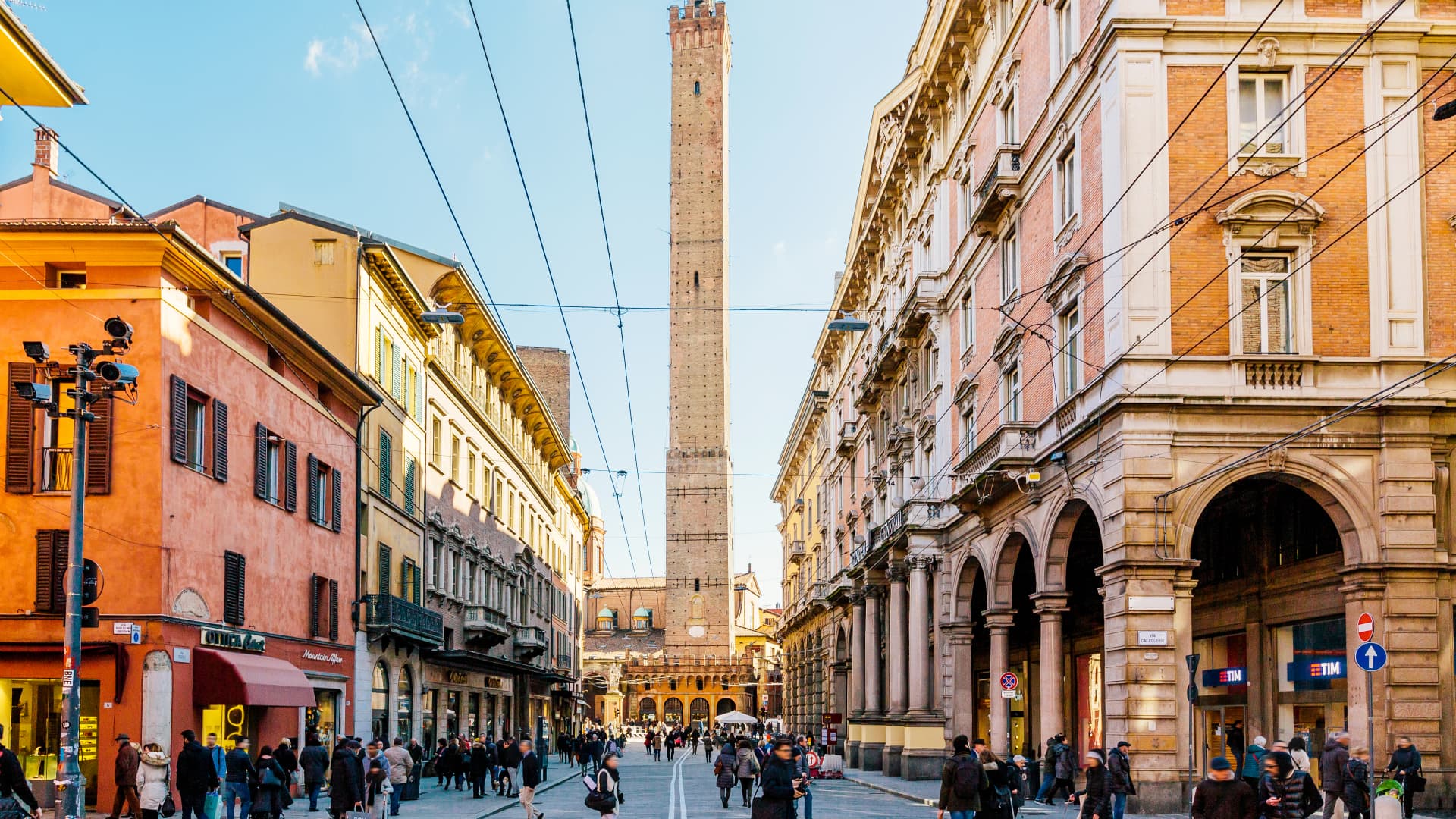 Street in Bologna with Asinelli tower in the center