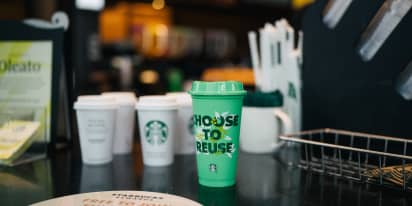 Starbucks' iconic coffee cup has a climate issue as mobile, drive-thru booms