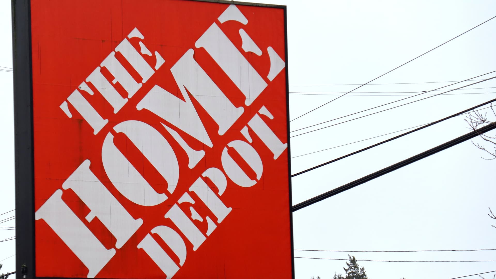 The logo of Home Depot is seen on a signboard near its store in Seattle. Home Depot is expected to report its quarterly earnings this week. 