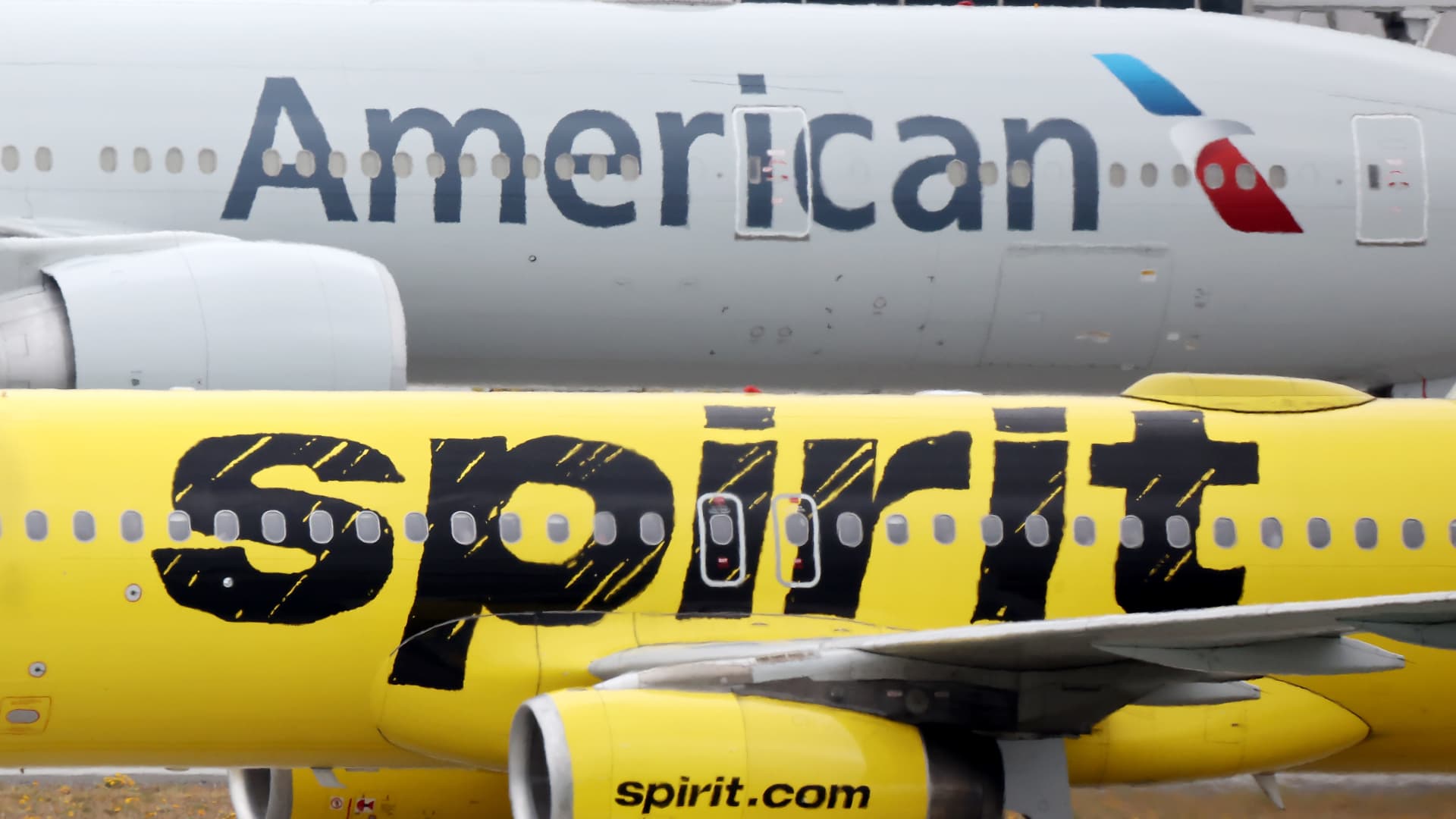 American Airlines, Spirit Airlines cut summer profit forecast on higher costs