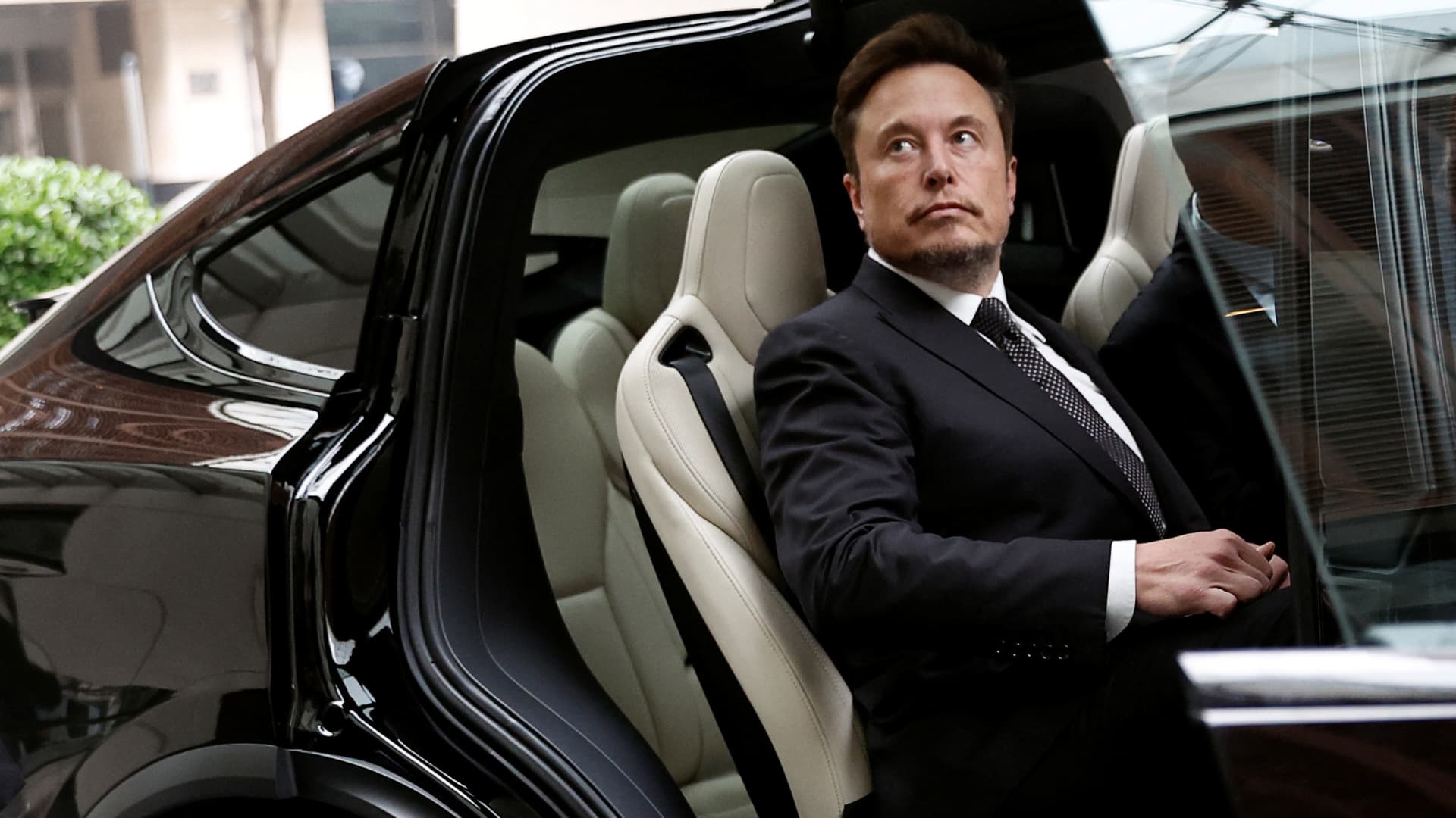 Tesla Chief Executive Officer Elon Musk gets in a Tesla car as he leaves a hotel in Beijing, China May 31, 2023.