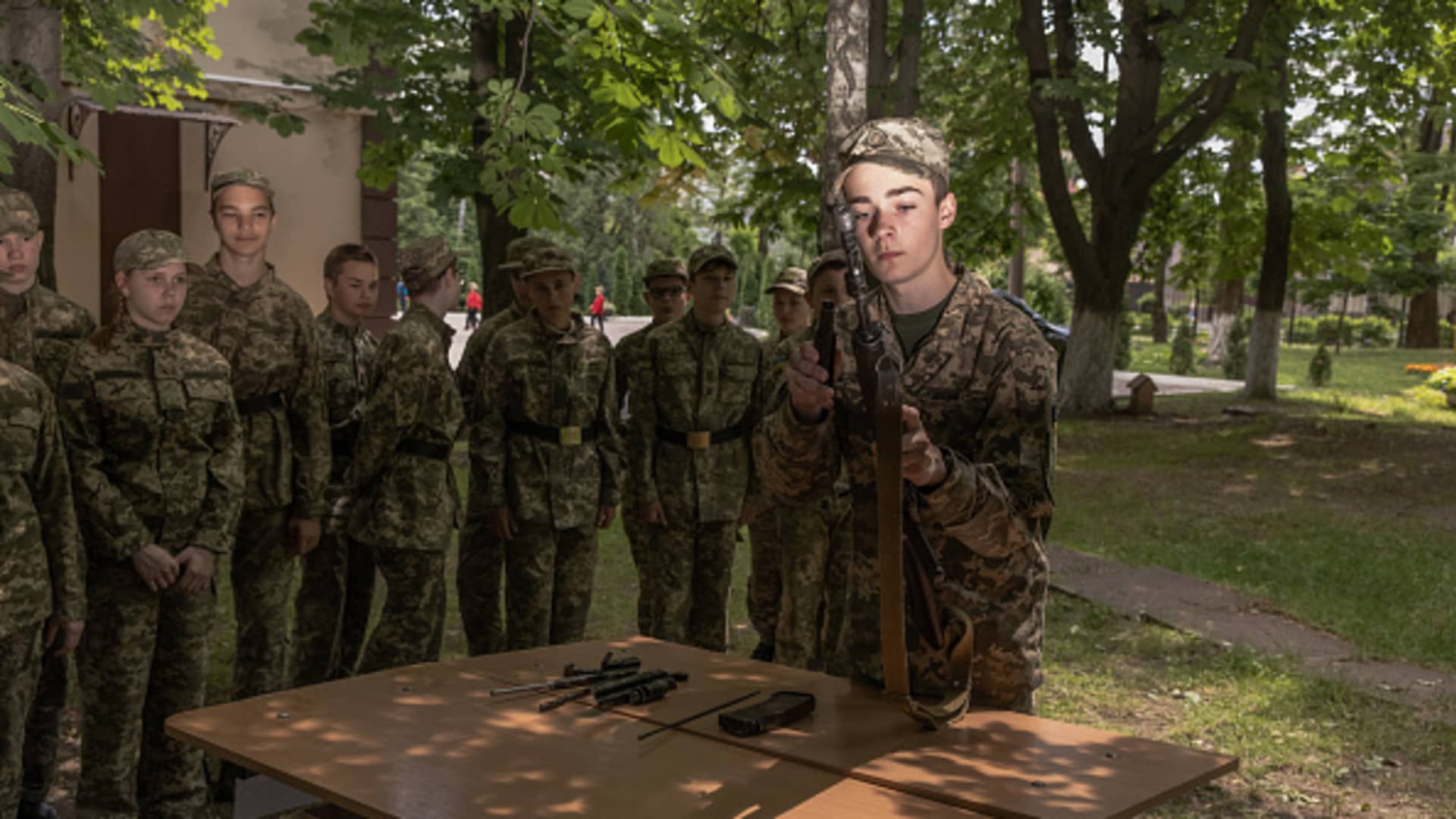 Young Ukrainian cadets compete in assembling weapons during a mass military education quest at State Lyceum 'Cadet Corps' on June 6, 2023 in Kyiv, Ukraine. 