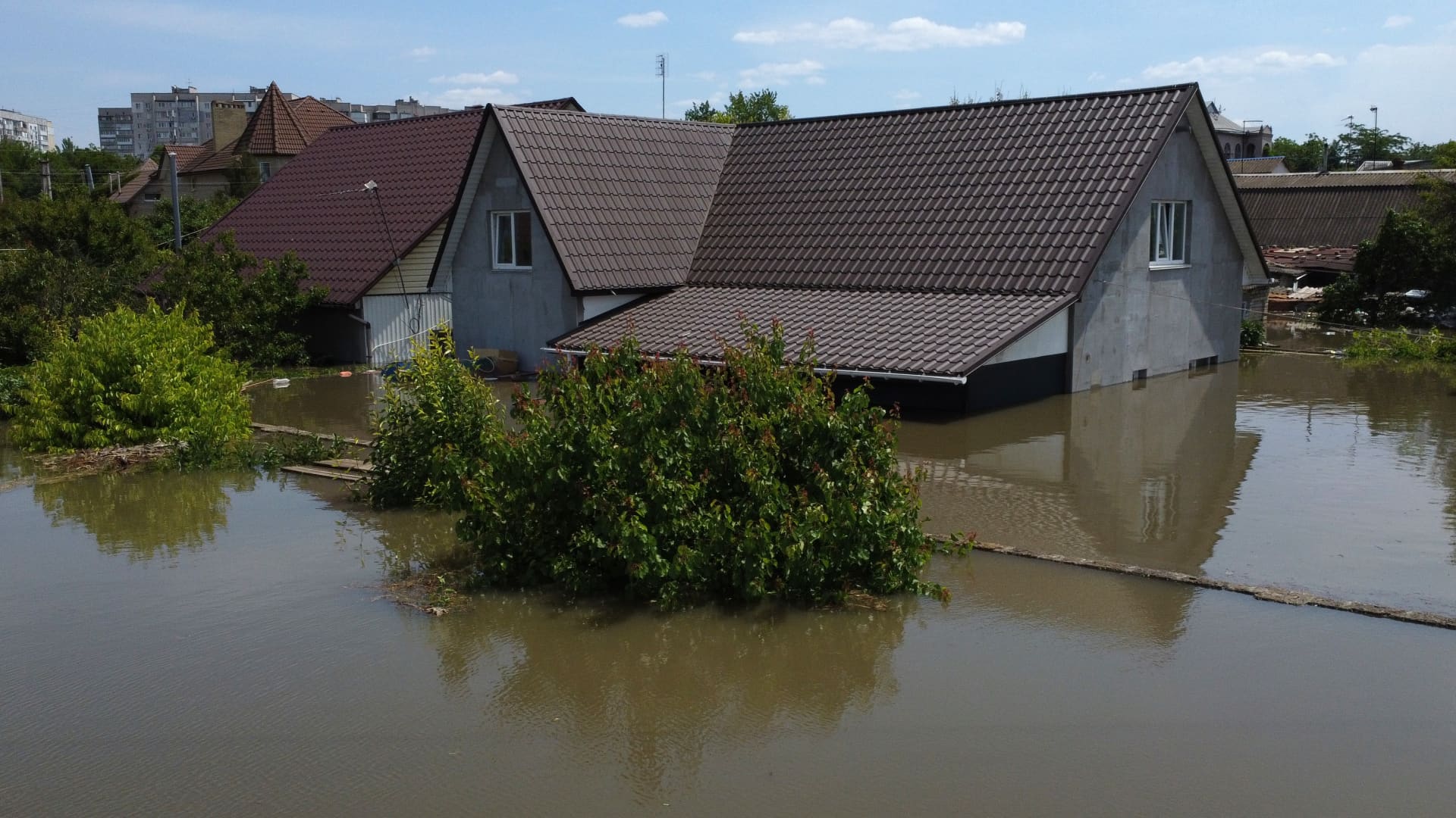 In an aerial view, residential houses in the flooded area of the city on June 7, 2023 in Kherson, Ukraine.