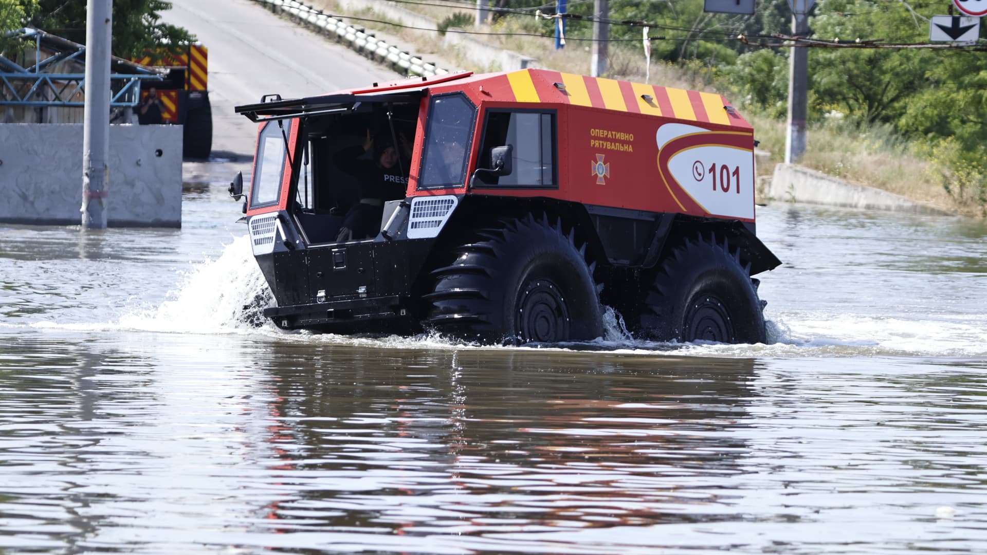 Rescuers ride in an amphibious all-terrain vehicle during evacuation in the flooded area of the city on June 7, 2023 in Kherson, Ukraine.