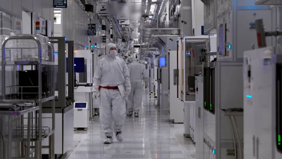 Samsung workers in the cleanroom of the company's Austin chip fab on April 19, 2023.