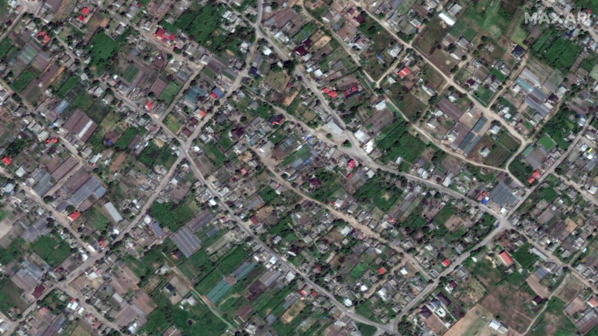 Maxar satellite imagery of the before/after images of flooded homes in Oleshky, Ukraine. 