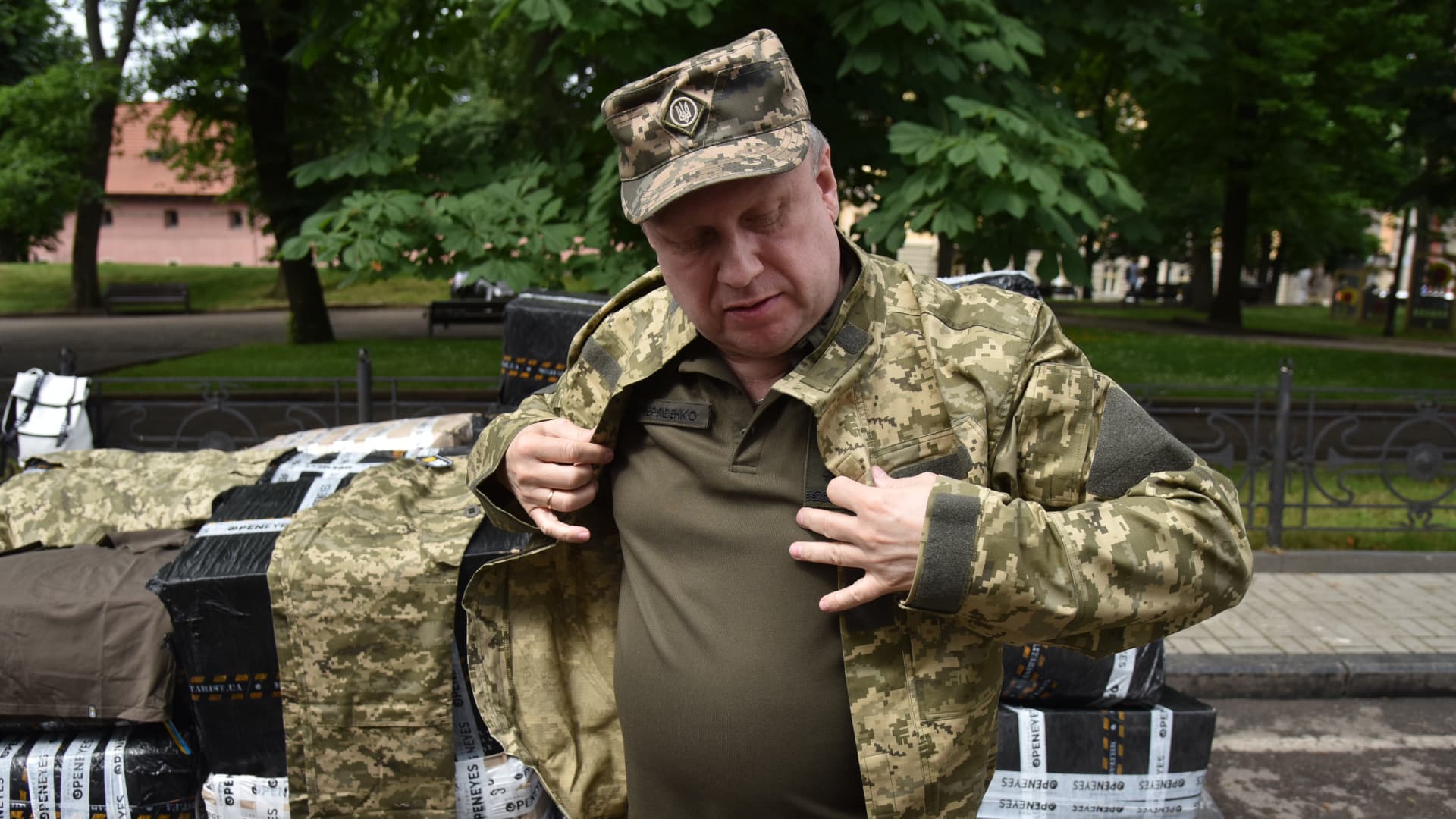 A Ukrainian military man tries on improved summer uniforms for the Ukrainian army in Lviv, Ukraine on June 9, 2023.