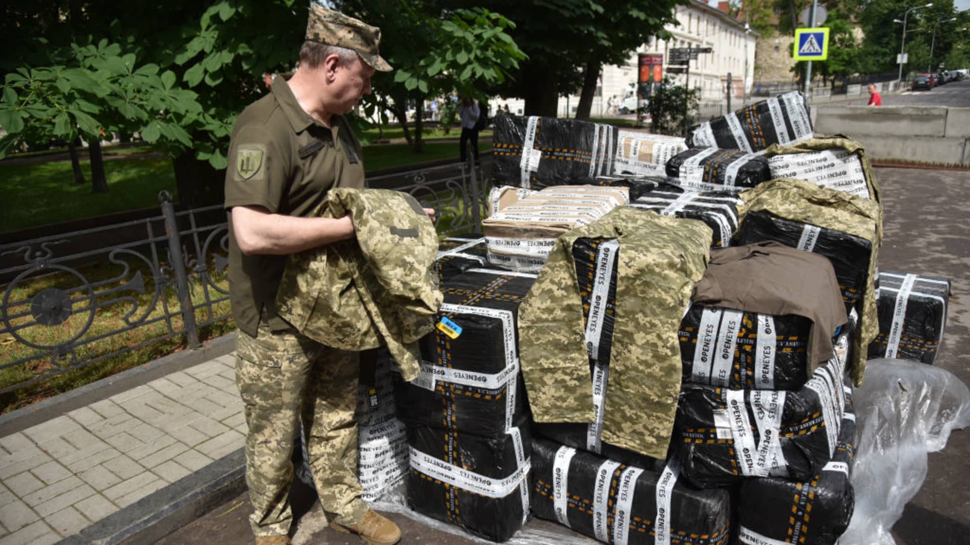 A Ukrainian military man examines improved summer uniforms for the Ukrainian army in Lviv, Ukraine on June 9, 2023.