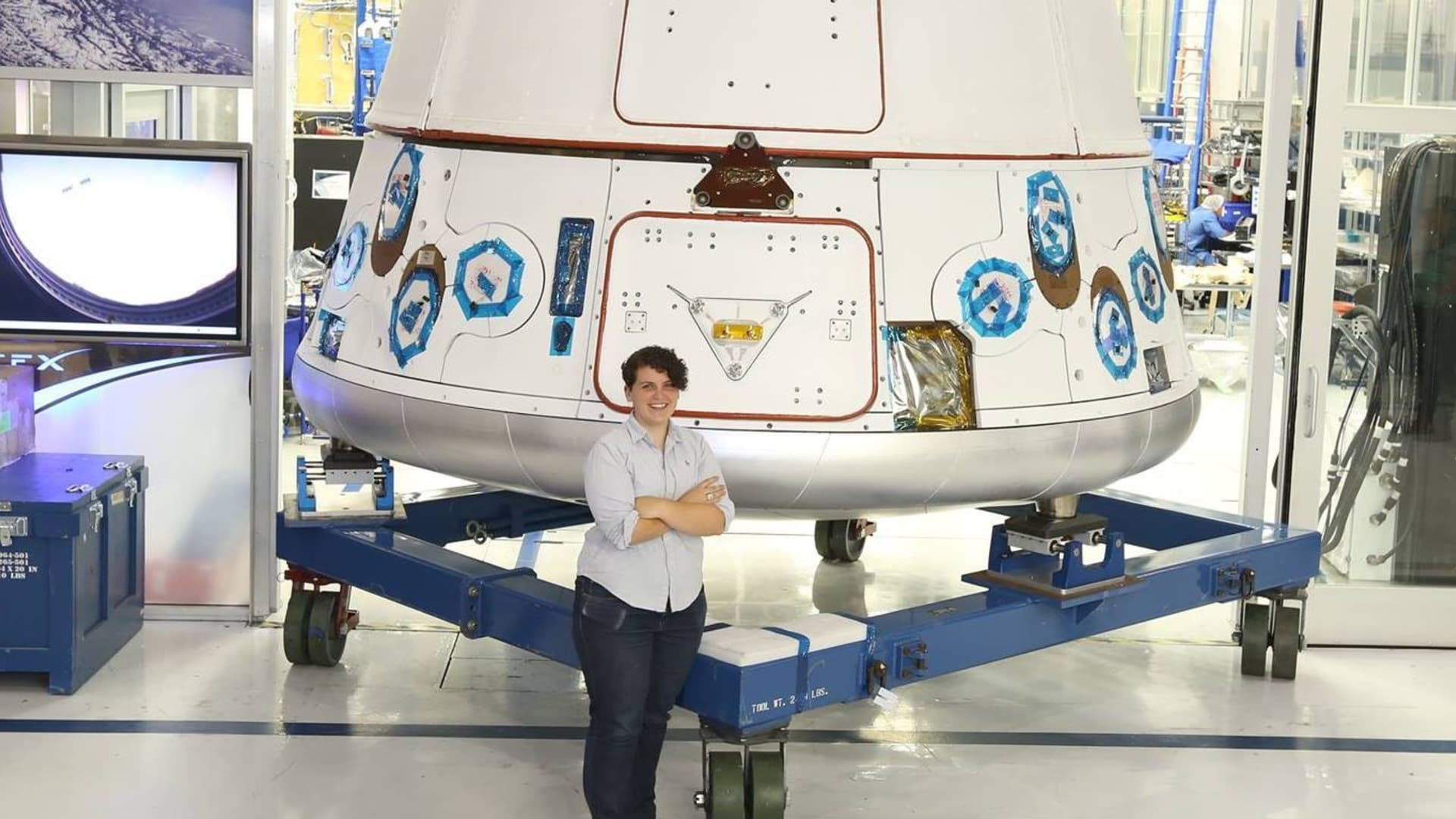 Darby Dunn with the SpaceX Dragon rocket.