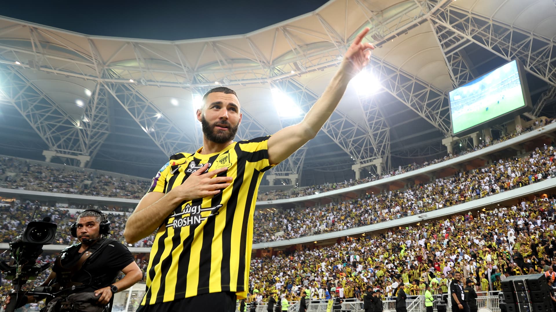 Karim Benzema acknowledges the fans as they are presented to the crowd during the Karim Benzema Official Reception event at King Abdullah Sports City on June 08, 2023 in Jeddah, Saudi Arabia.
