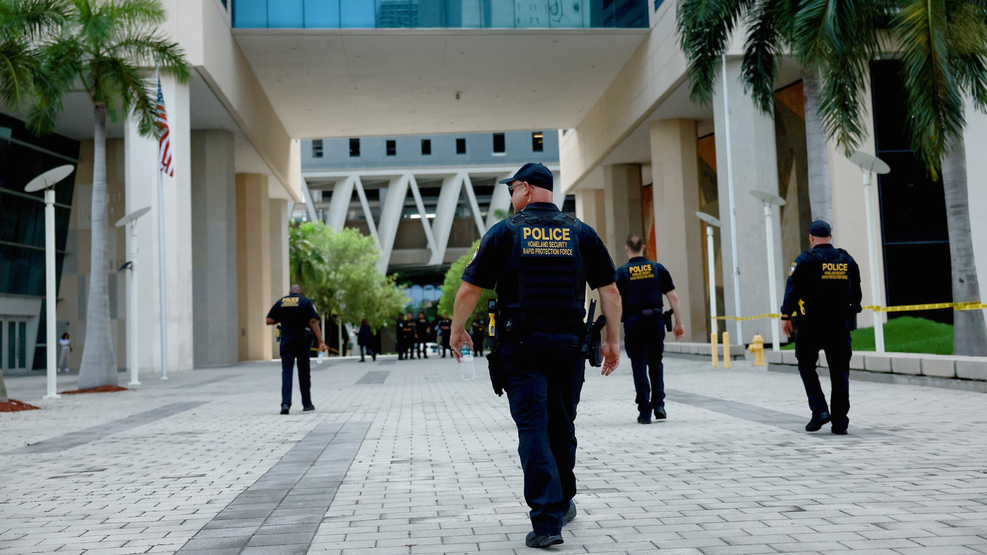 Department of Homeland Security police walk around the Wilkie D. Ferguson Jr. United States Federal Courthouse before the arraignment of former President Donald Trump on June 12, 2023 in Miami, Florida.