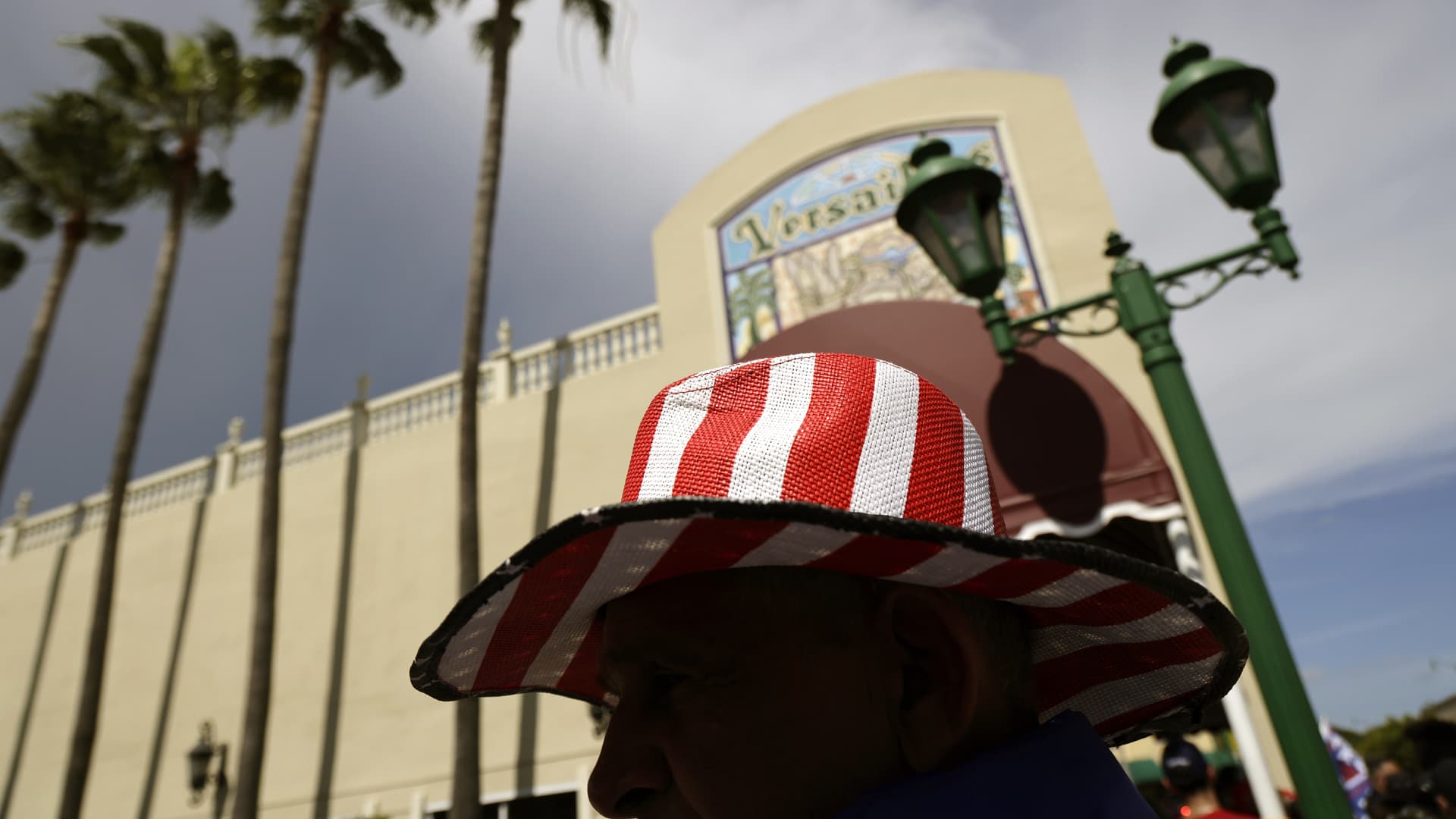 A person wears a striped hat as former U.S. President Donald Trump makes a visit to the Cuban restaurant Versailles after he appeared for his arraignment on June 13, 2023 in Miami, Florida.