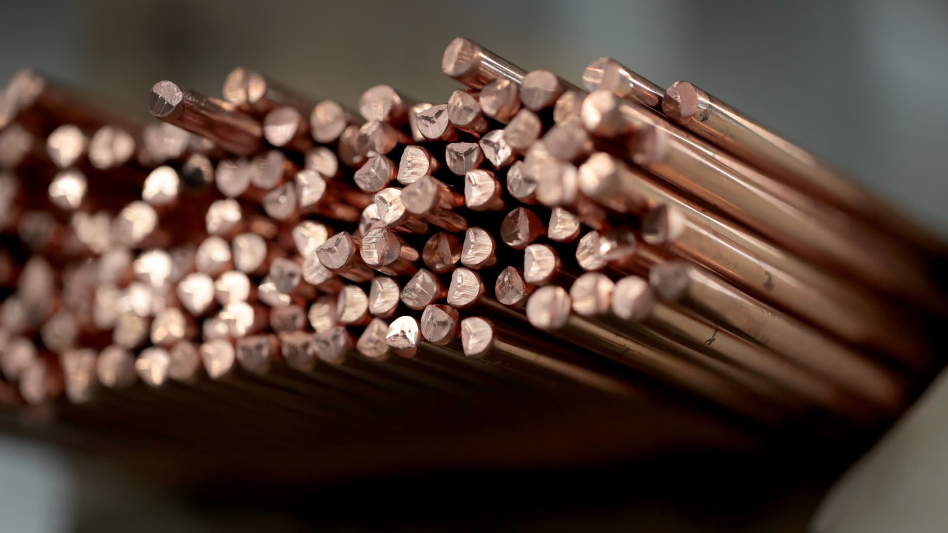 Copper rods used to machine parts are stacked on a shelf at Makerite Manufacturing in Roscoe, Illinois.
