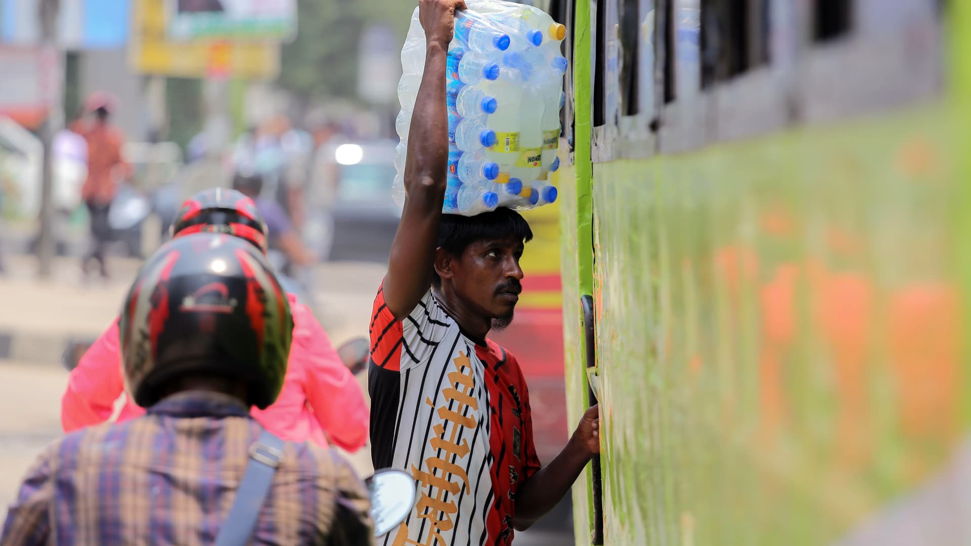 A street vendor selling bottles of chilled water amid high temperatures in Dhaka, Bangladesh, on Tuesday, June 6, 2023.