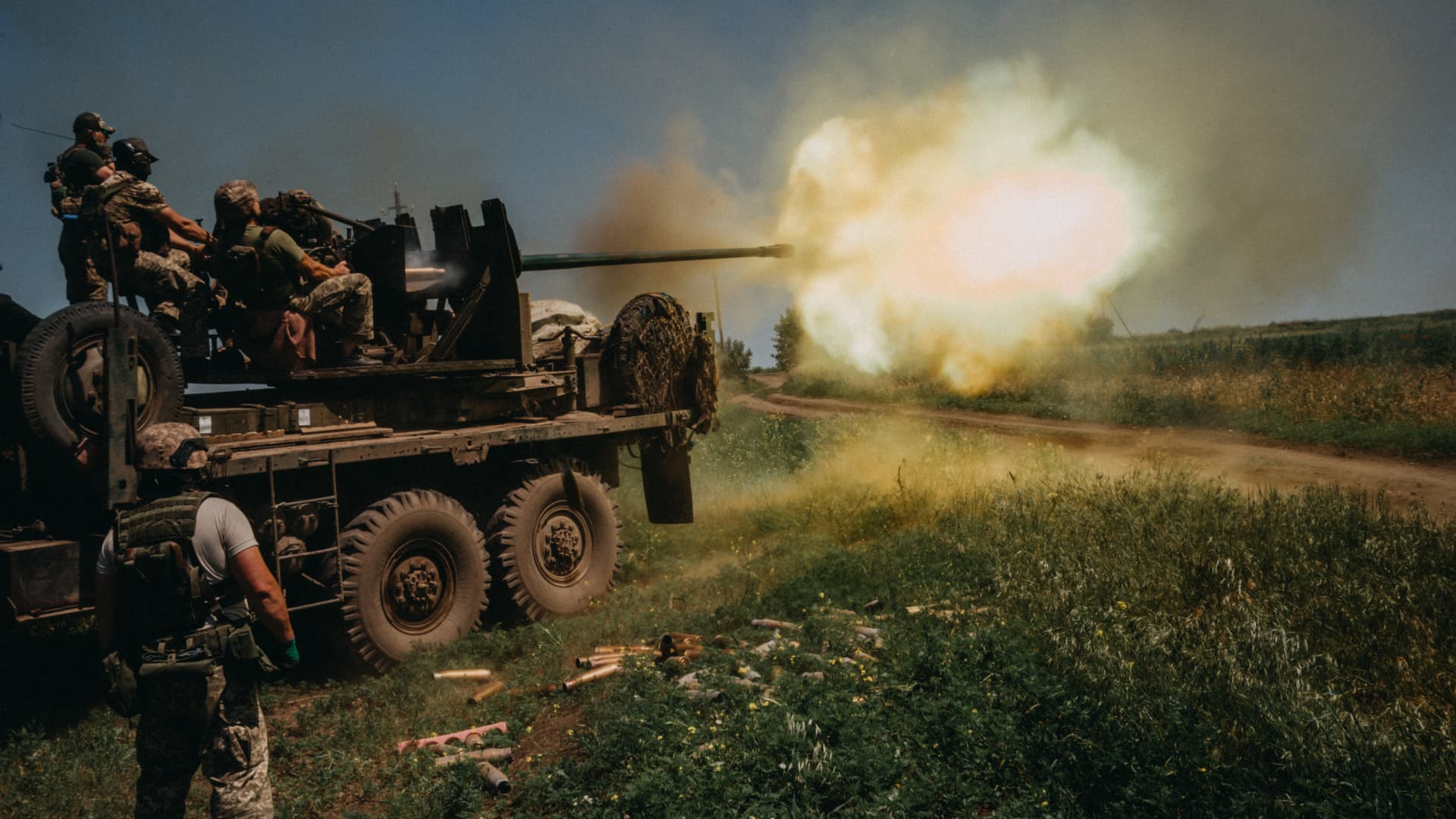 Ukrainian soldiers from the 60th Battalion of Territorial Defense, are shooting rounds into Russian positions with an S60 anti-aircraft canon placed on a truck, outside Bakhmut, Ukraine on June 19, 2023. 