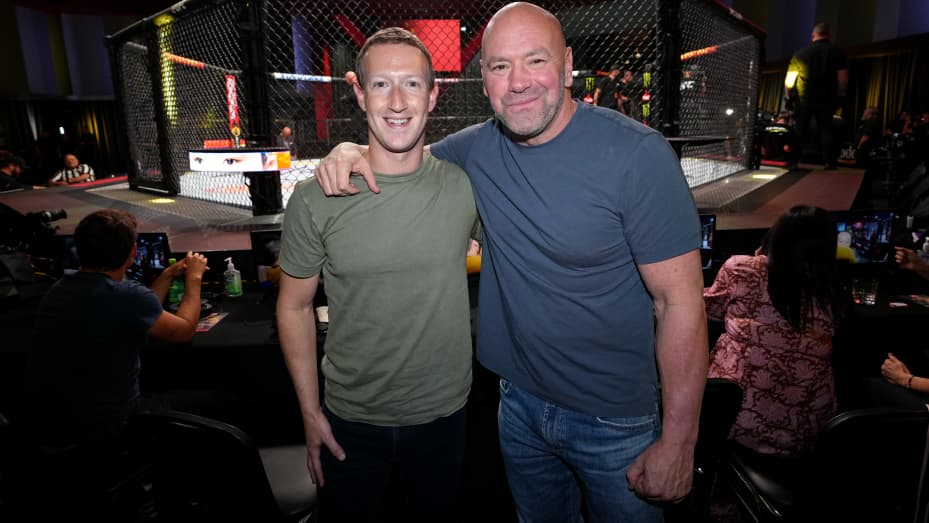 Mark Zuckerberg posing with UFC president Dana White during a UFC Fight Night event.