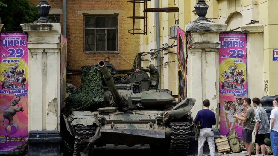 People look at a tank near a circus building in the city of Rostov-on-Don, on June 24, 2023.