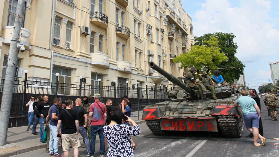 Members of Wagner group sit atop of a tank in a street in the city of Rostov-on-Don, on June 24, 2023.