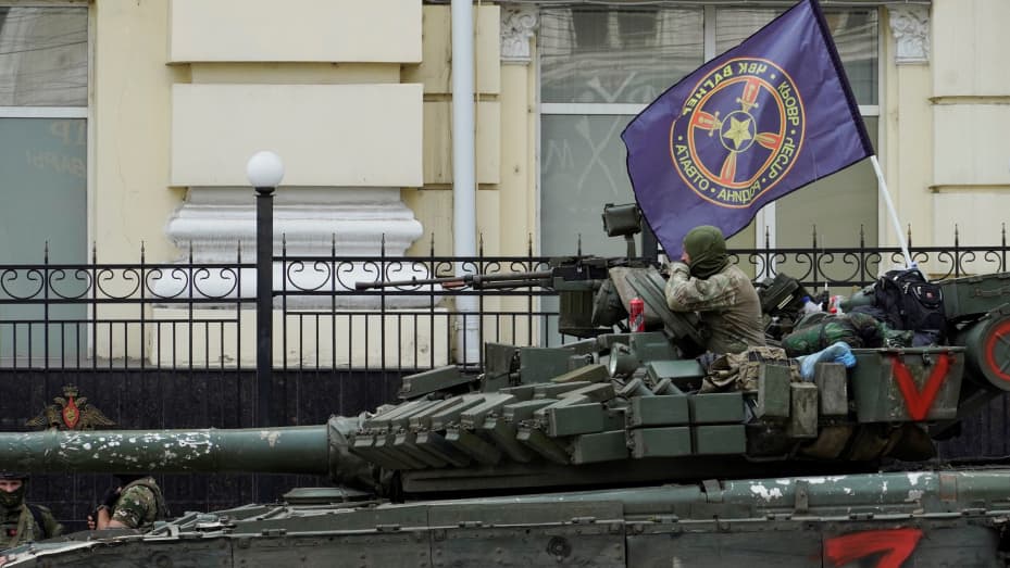 Members of Wagner group sit atop of a tank in a street in the city of Rostov-on-Don, on June 24, 2023. President Vladimir Putin on June 24, 2023 said an armed mutiny by Wagner mercenaries was a "stab in the back" and that the group's chief Yevgeny Prigozhin had betrayed Russia, as he vowed to punish the dissidents. Prigozhin said his fighters control key military sites in the southern city of Rostov-on-Don. (Photo by STRINGER / AFP) (Photo by STRINGER/AFP via Getty Images)