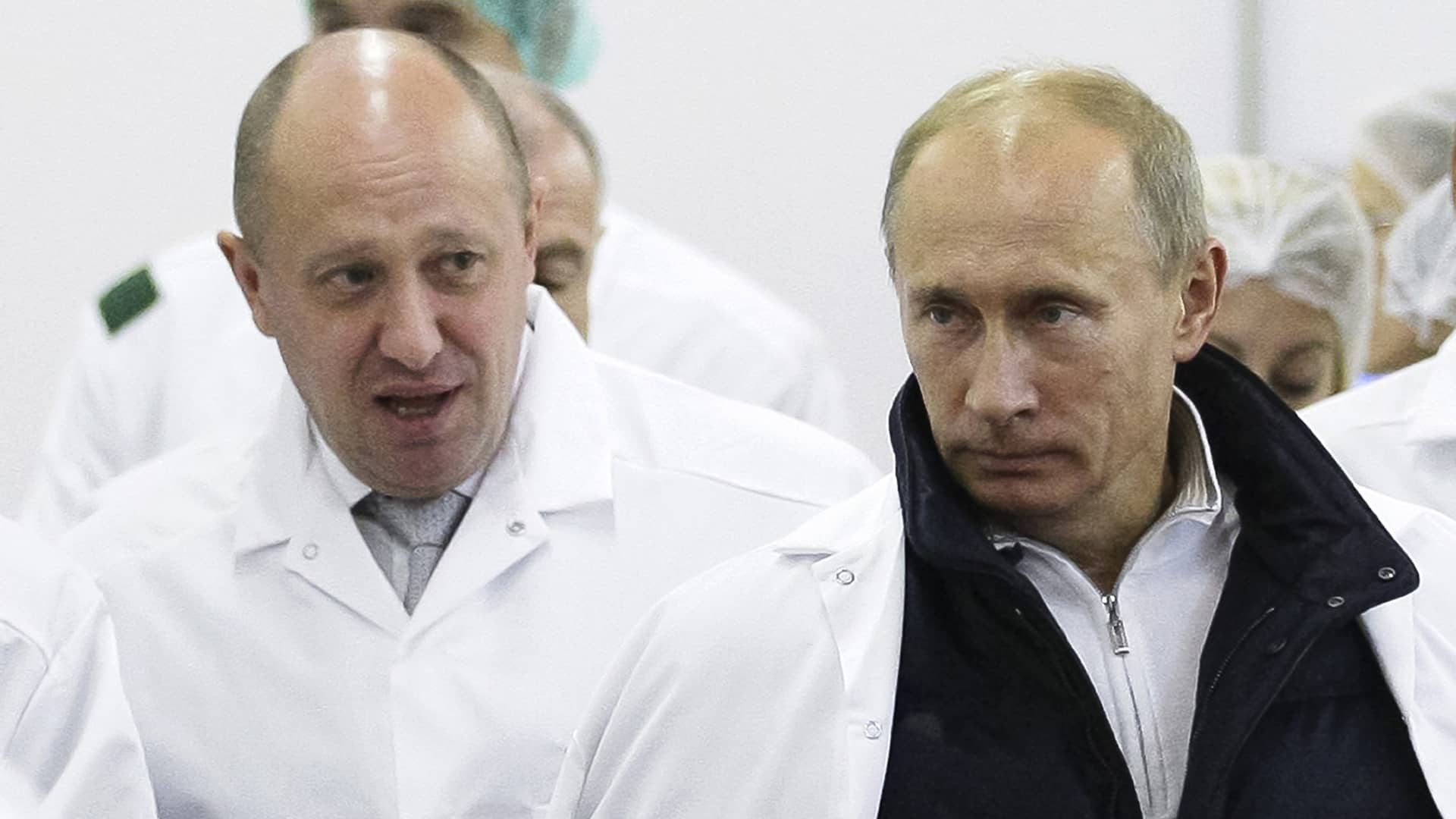 FILE - Businessman Yevgeny Prigozhin, left, shows Russian President Vladimir Putin, around his factory which produces school meals, outside St. Petersburg, Russia on Monday, Sept. 20, 2010.
