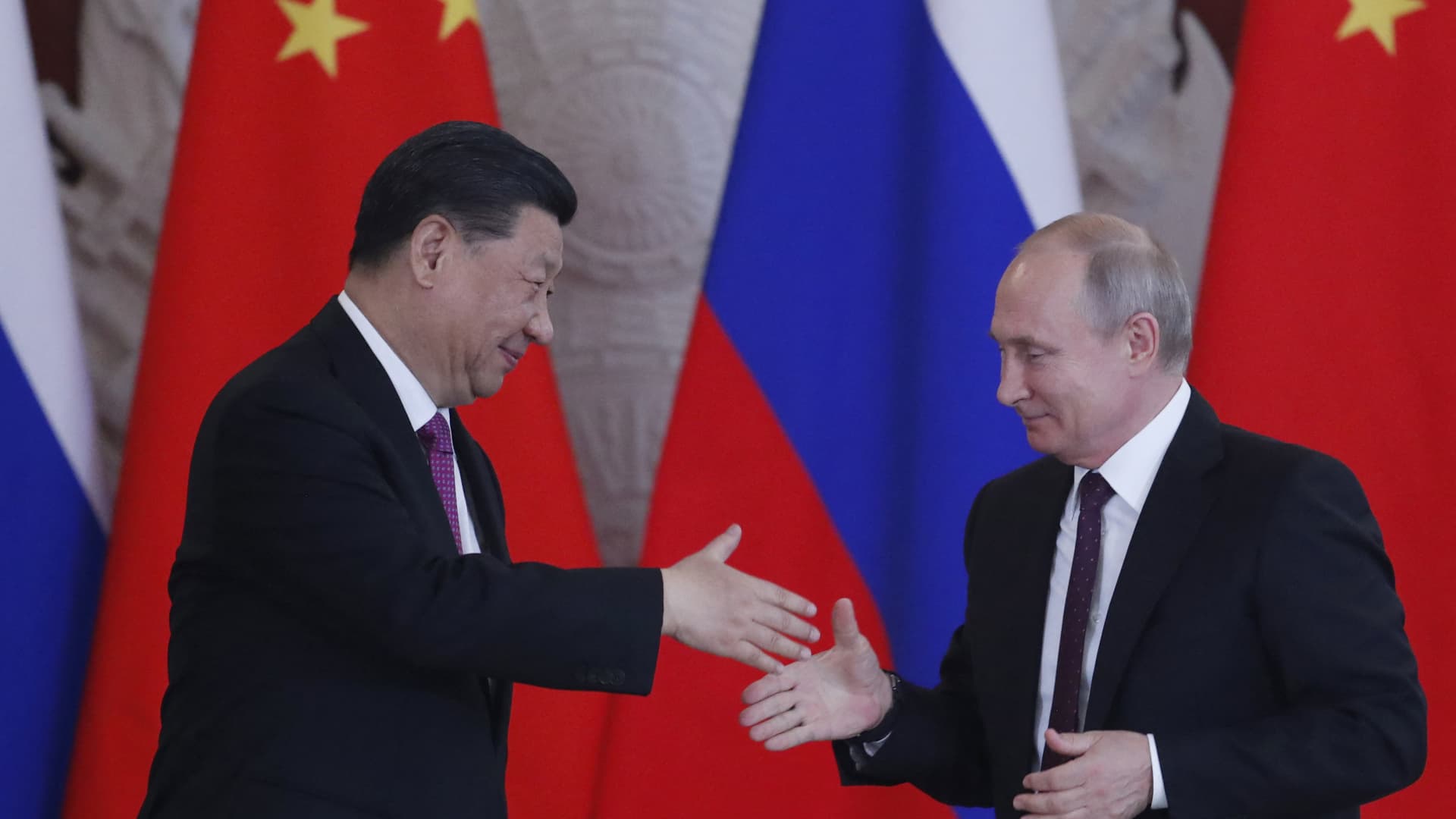 Russian President Vladimir Putin and his Chinese counterpart Xi Jinping shake hands at the end of a joint press conference following their talks at the Kremlin in Moscow on June 5, 2019.