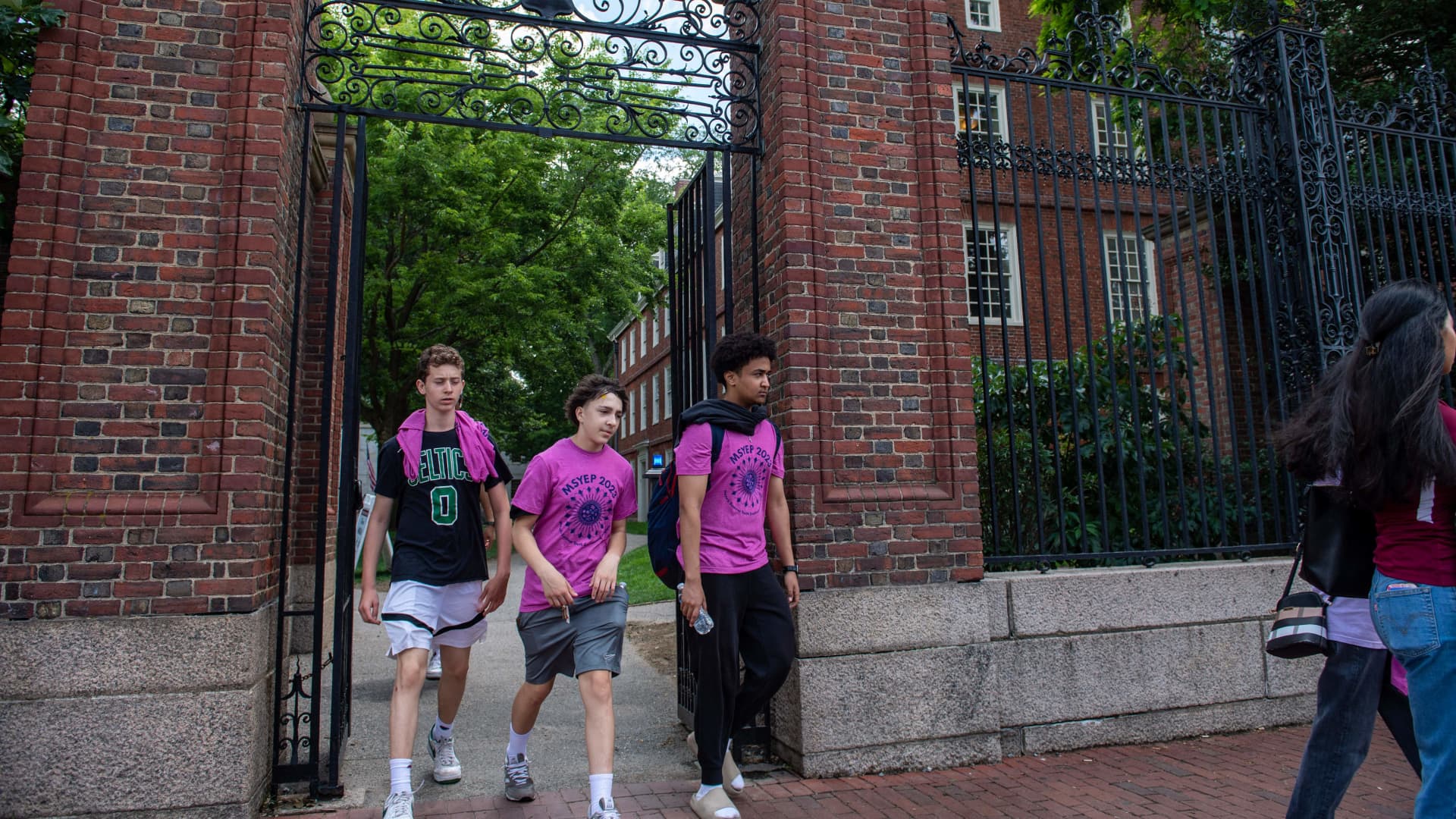 People exit Harvard Yard in Cambridge, Massachusetts, on June 29, 2023.