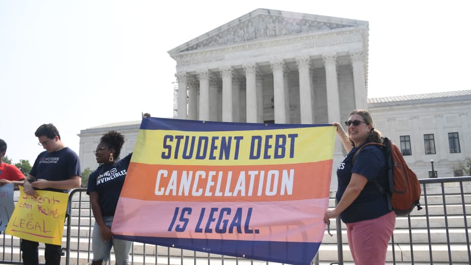 Supporters of student debt forgiveness demonstrate outside the US Supreme Court on June 30, 2023, in Washington, DC. The court is expected to announce a ruling on US President Joe Biden's plan to forgive student loans for millions of borrowers. (Photo by OLIVIER DOULIERY / AFP) (Photo by OLIVIER DOULIERY/AFP via Getty Images)