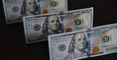 Dollar skids to two-month low, pound climbs to 15-month peak on wage growth data