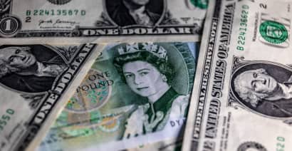 US dollar stumbles, drops to more than one-year low as inflation eases in June  