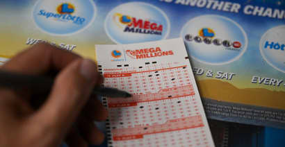 Mega Millions jackpot hits $910 million. Here's the tax bill if you win