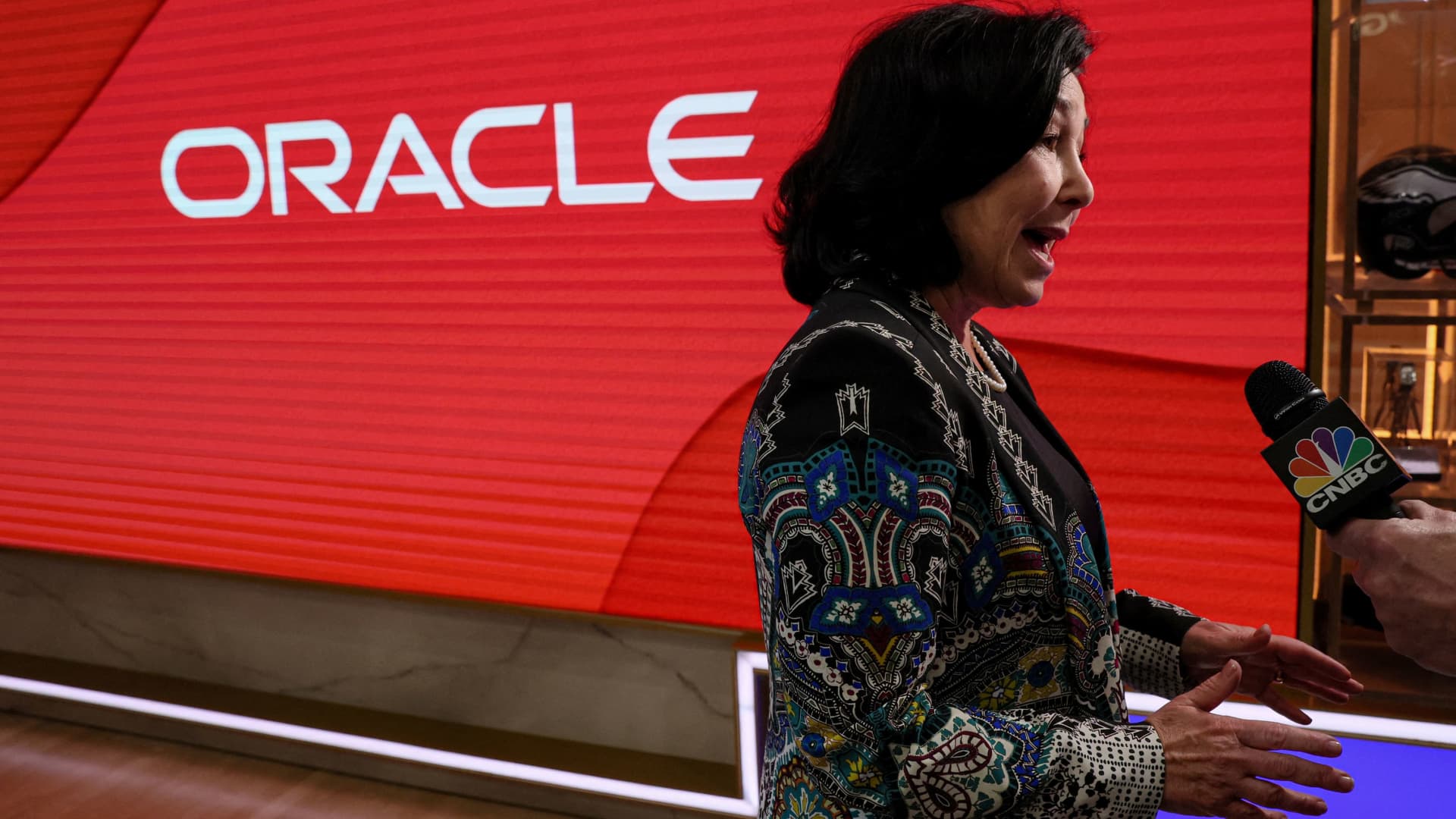 Oracle shares surge 12% and head for record close