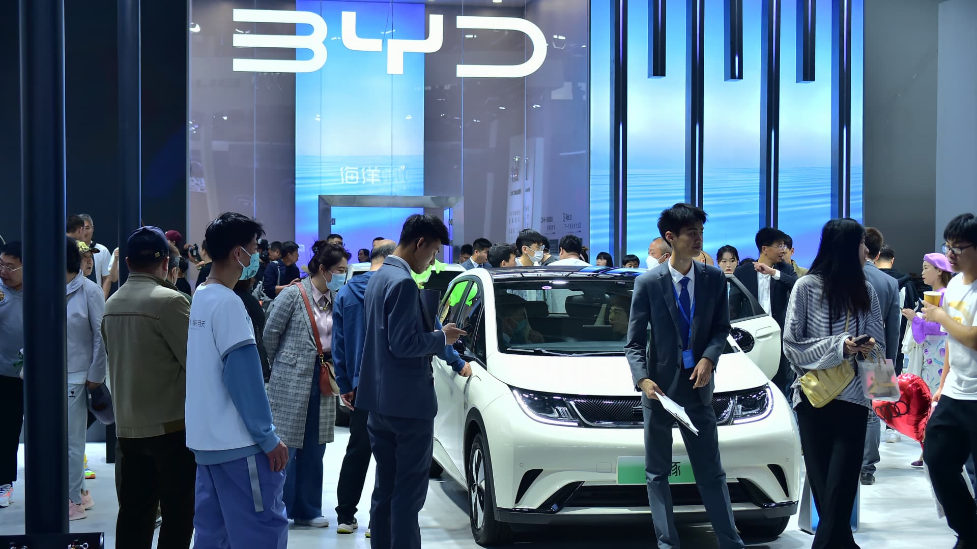 People look at a BYD Dolphin electric subcompact during the 2023 Shenyang International Auto Show on May 3, 2023 in Shenyang, Liaoning Province of China.