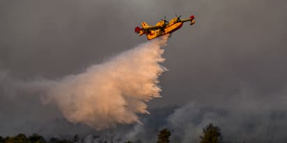 EU sends water bombers to combat Greece wildfires as temperature records tumble