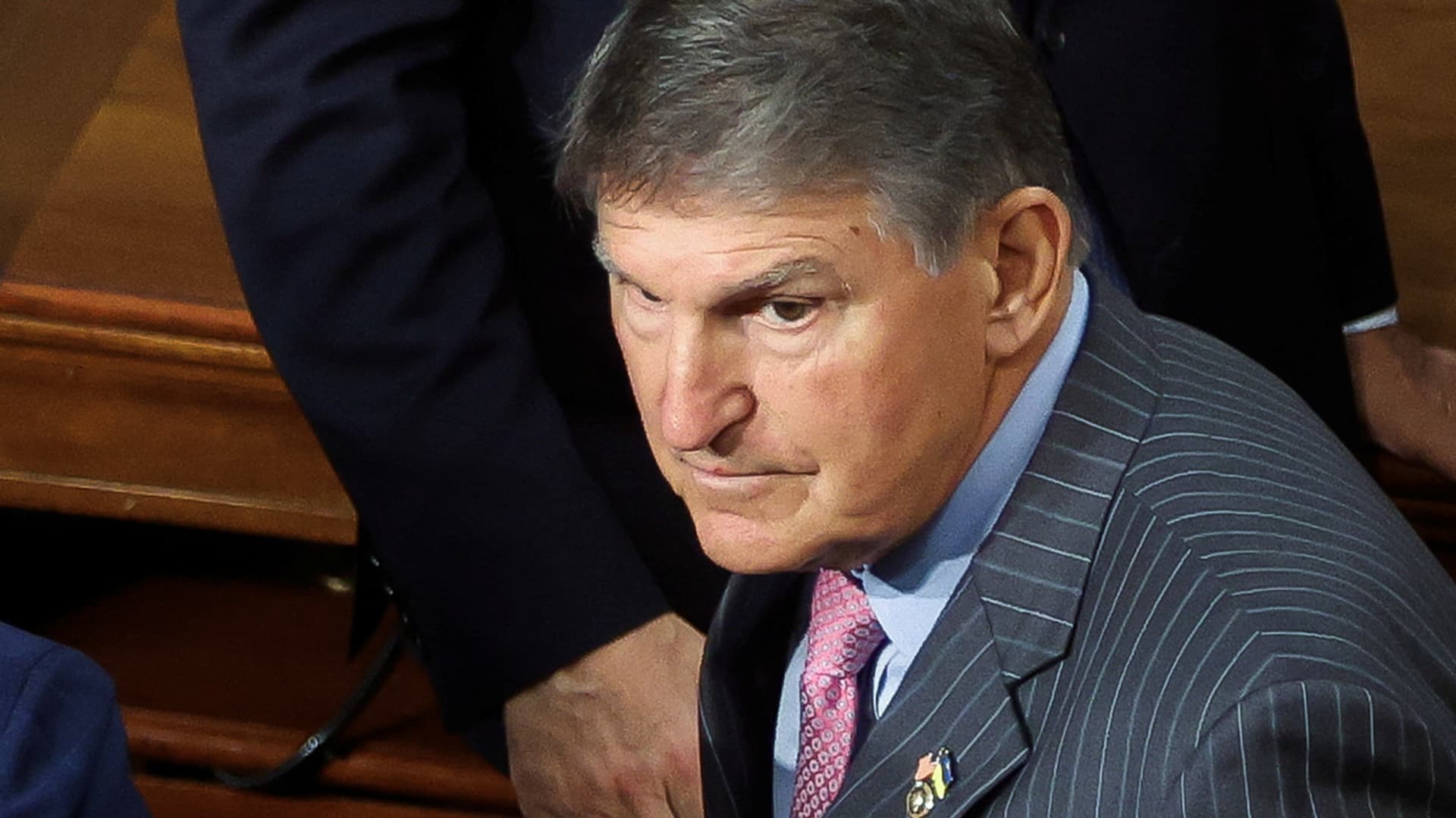 Manchin warns government to step up after Fitch credit rating downgrade