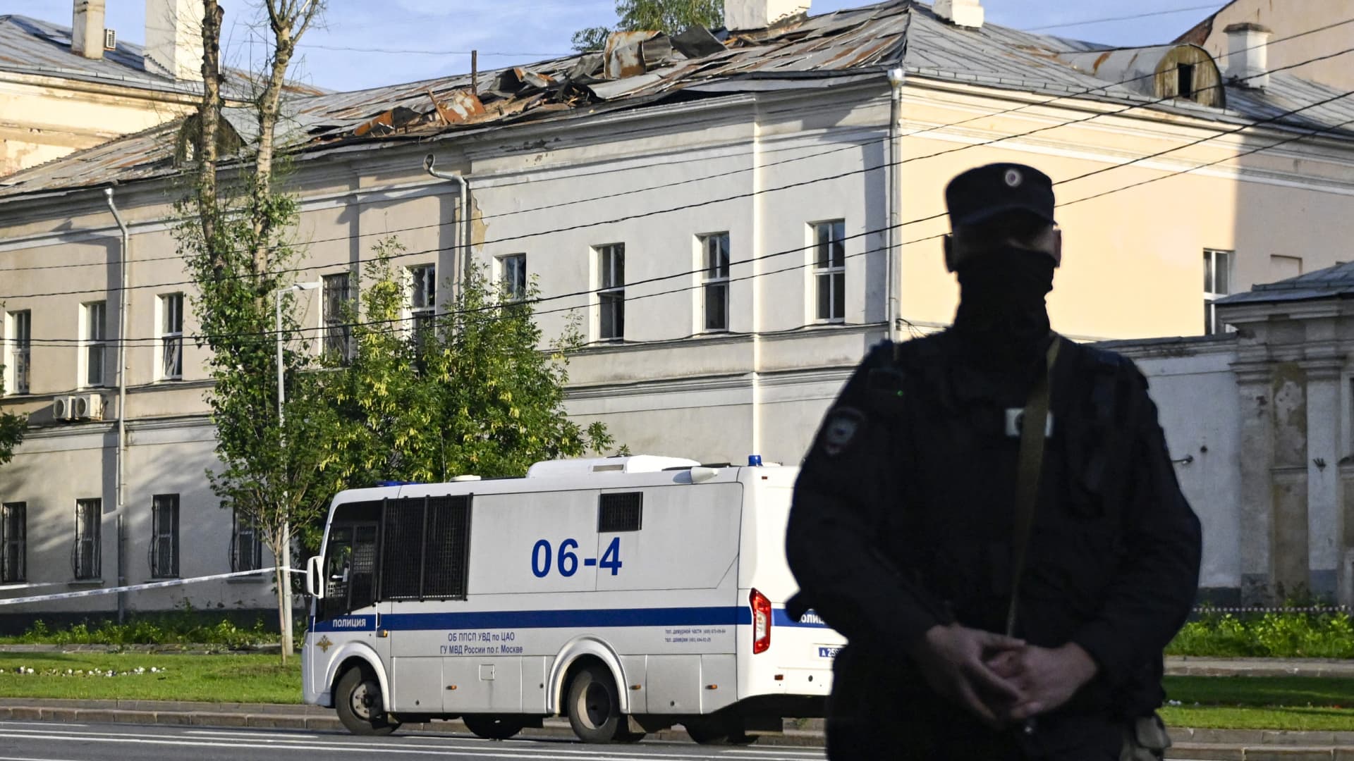 Police secures an area outside a damaged non-residential building on Komsomolsky Prospekt after a reported drone attack in Moscow on July 24, 2023. 